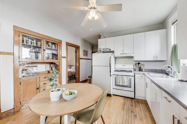 2333 N Spaulding Ave, Chicago, IL 60647 - kitchen with white appliances, under cabinet range hood, light wood finished floors, and white cabinets