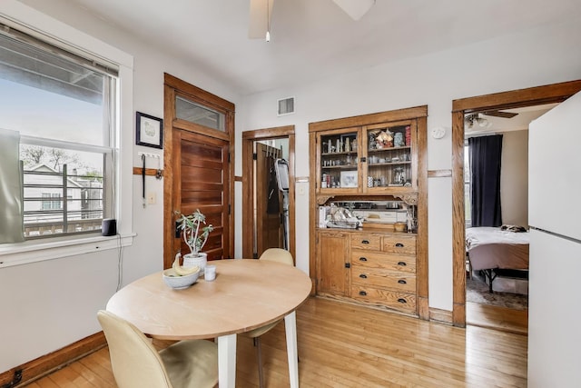 2333 N Spaulding Ave, Chicago, IL 60647 - dining area with a ceiling fan and light wood-type flooring