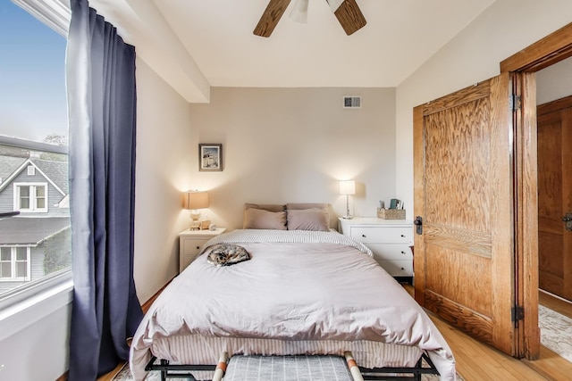 2333 N Spaulding Ave, Chicago, IL 60647 - bedroom featuring light wood finished floors, multiple windows, a ceiling fan, and vaulted ceiling