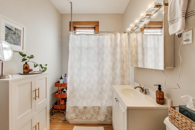 2333 N Spaulding Ave, Chicago, IL 60647 - full bathroom featuring vanity, wood finished floors, and curtained shower