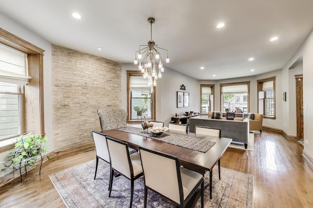 2333 N Spaulding Ave, Chicago, IL 60647 - dining room with healthy amount of natural light, light wood-style flooring, recessed lighting, and a chandelier