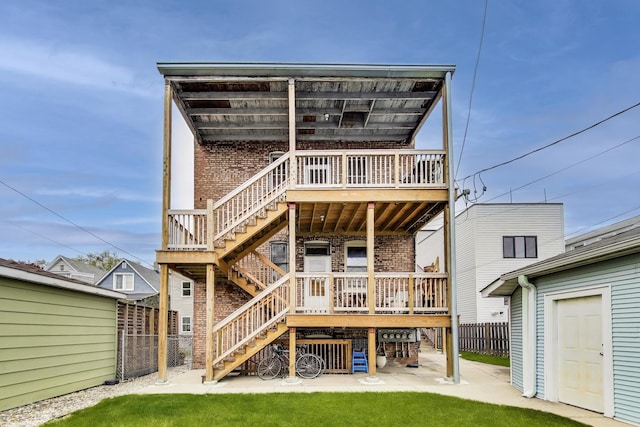 2333 N Spaulding Ave, Chicago, IL 60647 - back of house with stairway, brick siding, and a deck