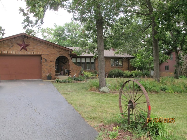 15521 116th Ct, Orland Park, IL 60467 - english style home featuring brick siding, a garage, a front yard, and driveway