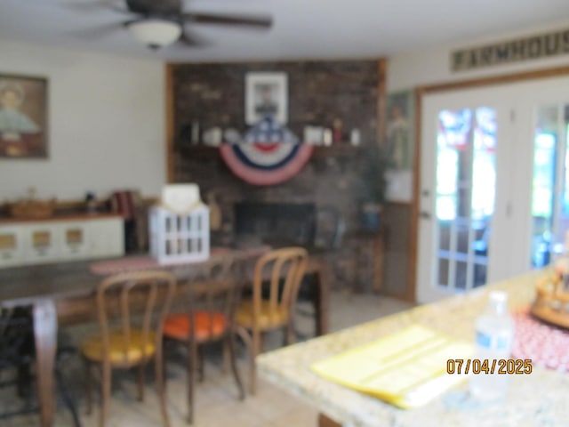 15521 116th Ct, Orland Park, IL 60467 - dining space featuring ceiling fan and a fireplace