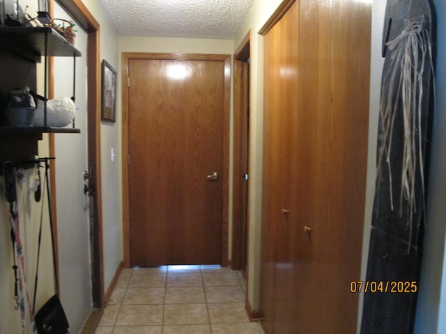 15521 116th Ct, Orland Park, IL 60467 - corridor featuring a textured ceiling and light tile patterned flooring