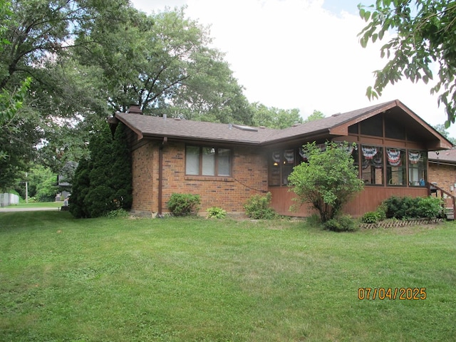 15521 116th Ct, Orland Park, IL 60467 - view of front of home featuring brick siding, a front yard, and roof with shingles