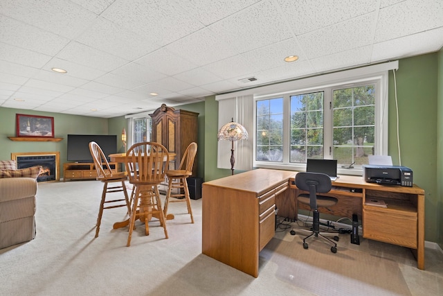 700 Monroe Dr, Lindenhurst, IL 60046 - office featuring light carpet, plenty of natural light, a glass covered fireplace, recessed lighting, and a drop ceiling