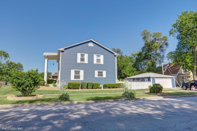 25 E 150th St, Harvey, IL 60426 - view of side of property with a yard and a detached garage