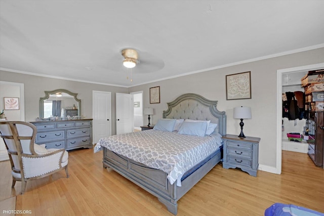 25 E 150th St, Harvey, IL 60426 - bedroom with light wood-type flooring, a closet, ornamental molding, a ceiling fan, and a spacious closet