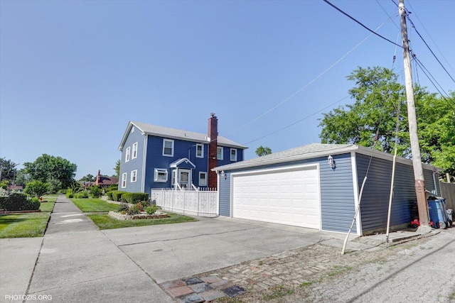 25 E 150th St, Harvey, IL 60426 - view of front of home with a detached garage and an outbuilding