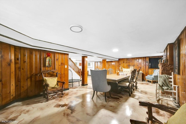 25 E 150th St, Harvey, IL 60426 - dining area with wooden walls, stairway, and concrete floors