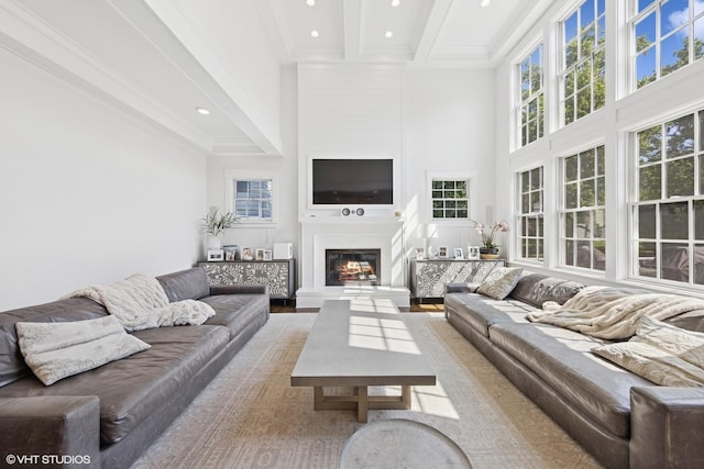 4603 Oakwood Ave, Downers Grove, IL 60515 - living area featuring a high ceiling, beam ceiling, a glass covered fireplace, recessed lighting, and ornamental molding