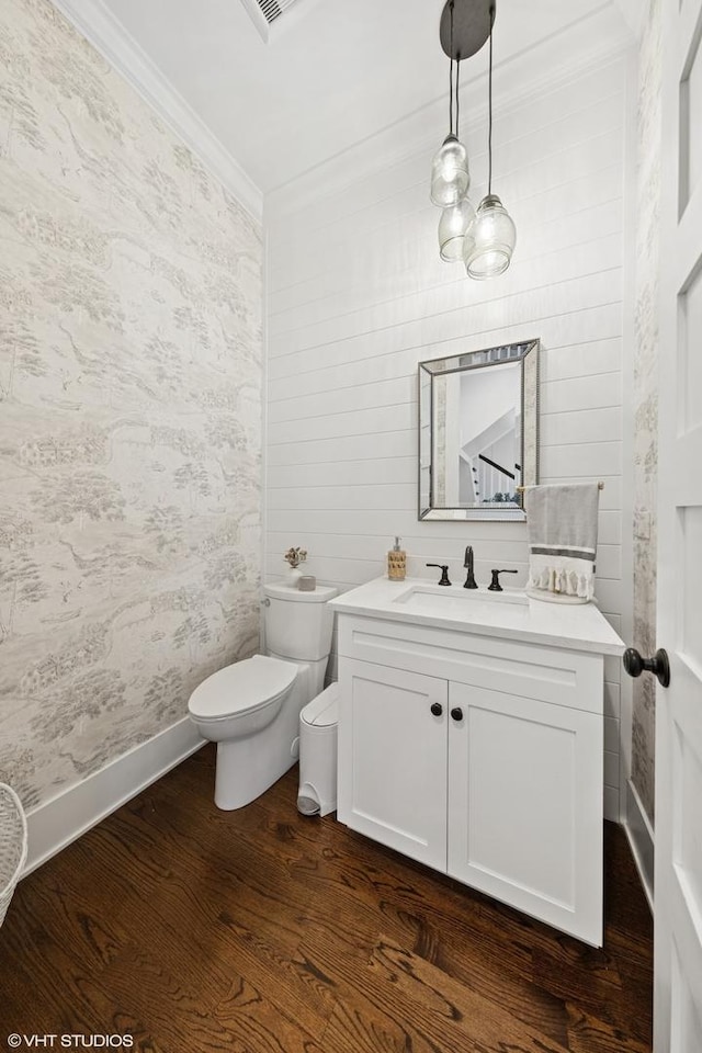 4603 Oakwood Ave, Downers Grove, IL 60515 - half bathroom featuring ornamental molding, vanity, and wood finished floors