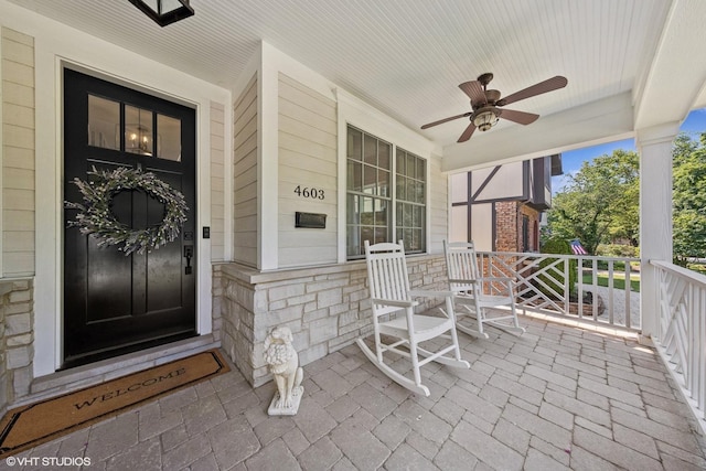 4603 Oakwood Ave, Downers Grove, IL 60515 - view of exterior entry with a porch, a ceiling fan, and stone siding