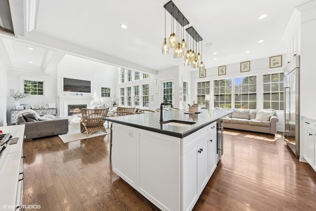 4603 Oakwood Ave, Downers Grove, IL 60515 - kitchen with open floor plan, dark countertops, a glass covered fireplace, dark wood-style floors, and wine cooler