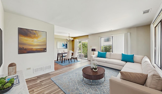 9221 Auburn Ct, Orland Park, IL 60462 - living room with a chandelier and light wood finished floors