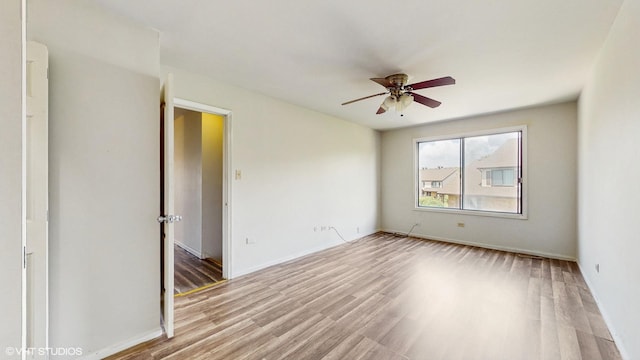 9221 Auburn Ct, Orland Park, IL 60462 - spare room with a ceiling fan and wood finished floors