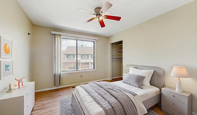 9221 Auburn Ct, Orland Park, IL 60462 - bedroom with light wood-style flooring, a closet, and ceiling fan