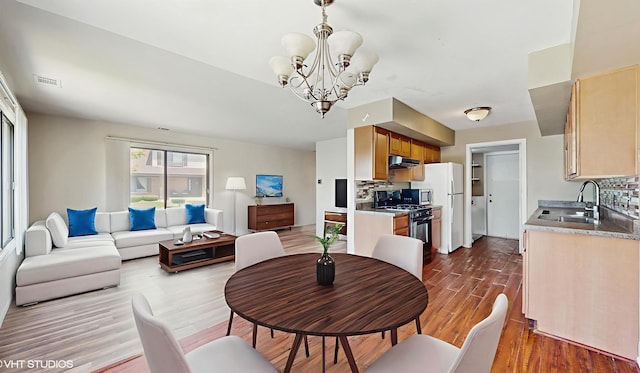 9221 Auburn Ct, Orland Park, IL 60462 - dining area featuring wood finished floors and a chandelier