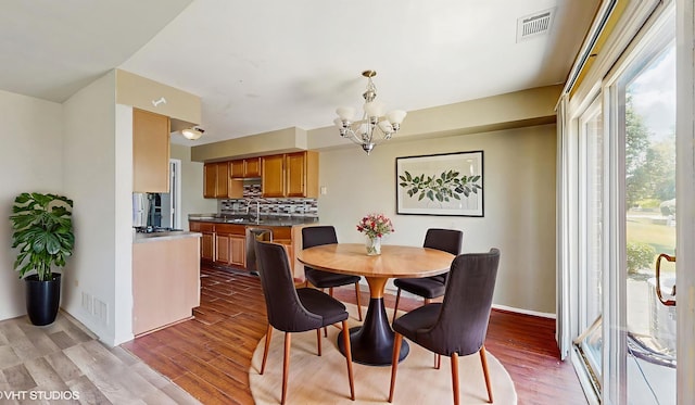 9221 Auburn Ct, Orland Park, IL 60462 - dining space with a chandelier and wood finished floors