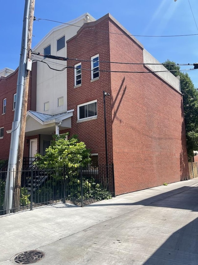 1027 W Vernon Park Pl Unit B, Chicago, IL 60607 - view of home's exterior with brick siding