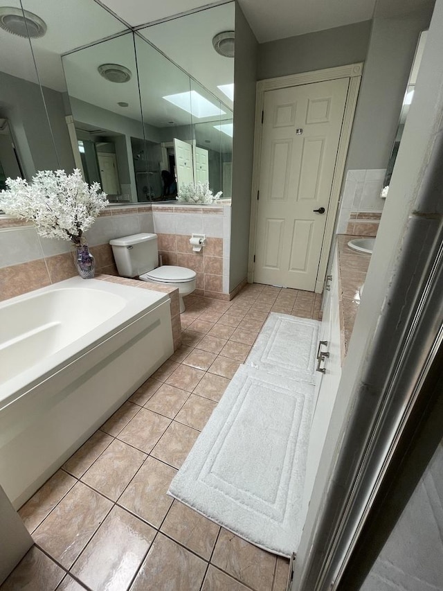 1027 W Vernon Park Pl Unit B, Chicago, IL 60607 - full bathroom with vanity, tile patterned floors, and tile walls