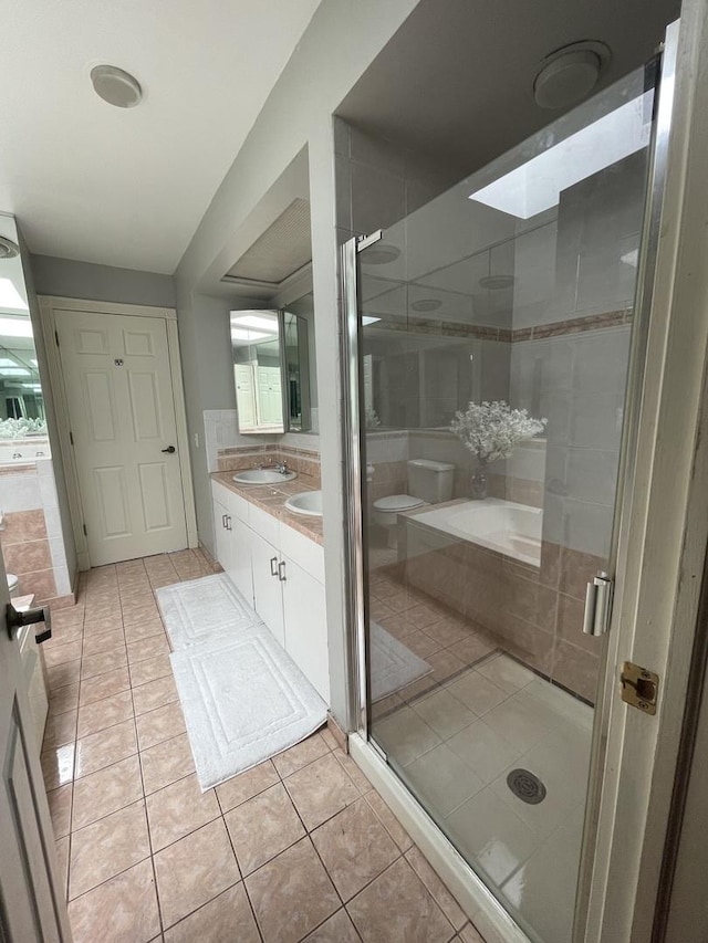 1027 W Vernon Park Pl Unit B, Chicago, IL 60607 - bathroom with tile patterned flooring, double vanity, and a shower stall