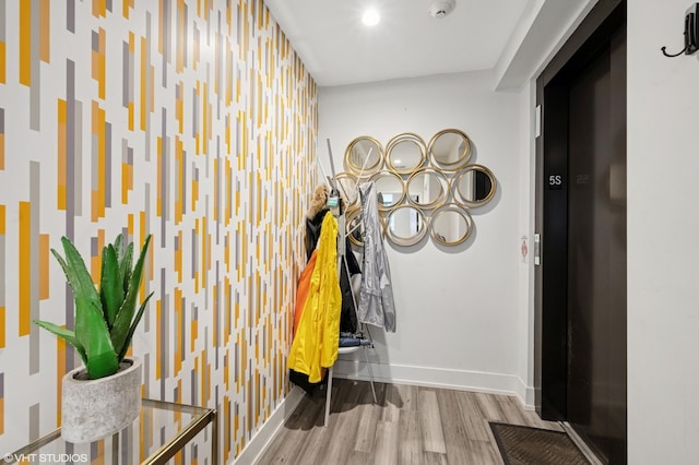 1018 N Larrabee St Unit 5S, Chicago, IL 60610 - hallway featuring wood finished floors and baseboards