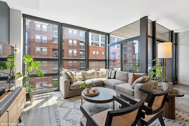 1018 N Larrabee St Unit 5S, Chicago, IL 60610 - living room with healthy amount of natural light, expansive windows, and wood finished floors