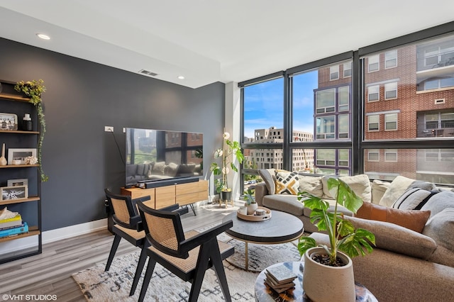 1018 N Larrabee St Unit 5S, Chicago, IL 60610 - living room featuring wood finished floors, expansive windows, and recessed lighting