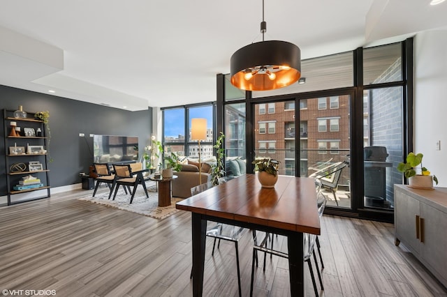 1018 N Larrabee St Unit 5S, Chicago, IL 60610 - dining space featuring wood finished floors and floor to ceiling windows