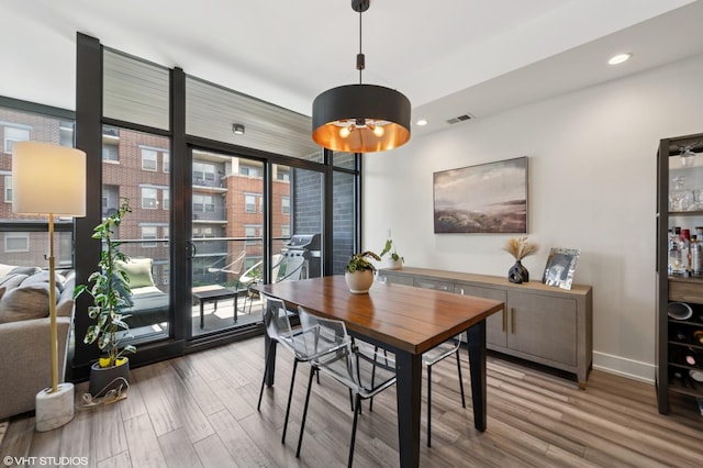 1018 N Larrabee St Unit 5S, Chicago, IL 60610 - dining space with wood finished floors and recessed lighting