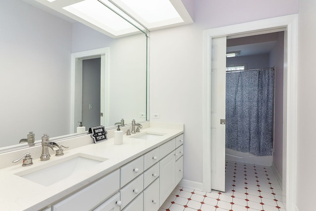 15442 W Purley Ct, Homer Glen, IL 60491 - bathroom featuring double vanity, a skylight, and a shower with curtain
