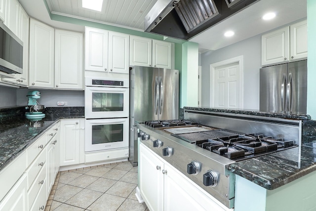 15442 W Purley Ct, Homer Glen, IL 60491 - kitchen with stainless steel appliances, white cabinetry, light tile patterned flooring, dark stone counters, and recessed lighting