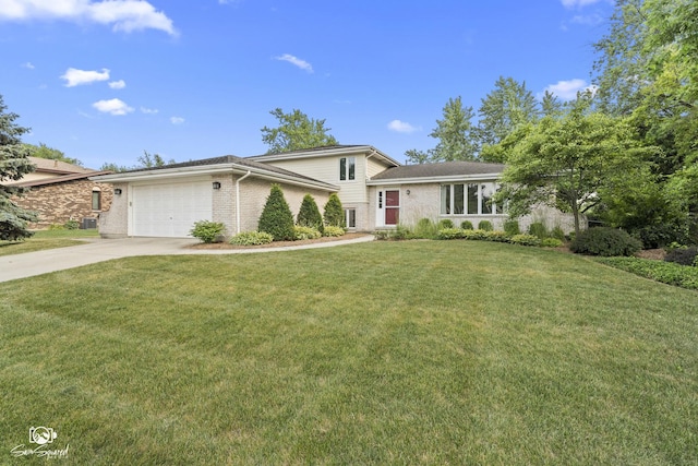 658 Brookside Ln, Frankfort, IL 60423 - split level home with a garage, concrete driveway, brick siding, and a front lawn