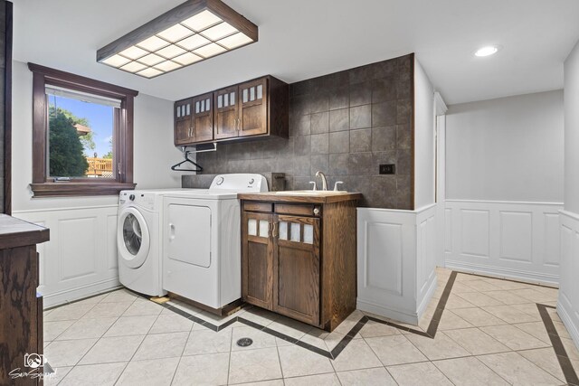 658 Brookside Ln, Frankfort, IL 60423 - laundry area with washing machine and dryer, cabinet space, recessed lighting, light tile patterned floors, and a wainscoted wall