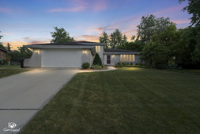 658 Brookside Ln, Frankfort, IL 60423 - view of front of house with brick siding, concrete driveway, an attached garage, and a lawn