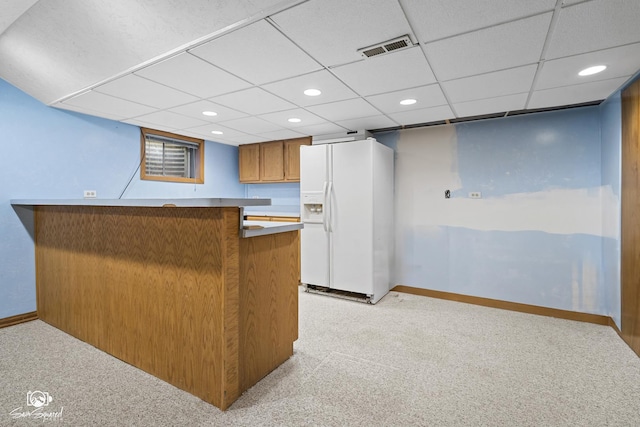 658 Brookside Ln, Frankfort, IL 60423 - kitchen with white refrigerator with ice dispenser, light colored carpet, recessed lighting, a drop ceiling, and brown cabinets
