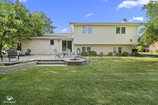 658 Brookside Ln, Frankfort, IL 60423 - rear view of house featuring a yard, an outdoor fire pit, a chimney, and a patio