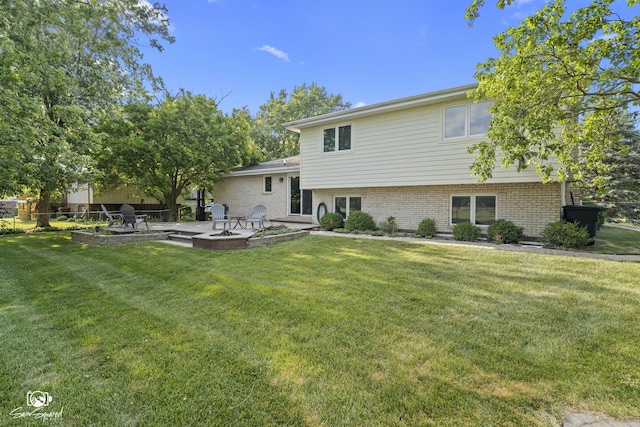 658 Brookside Ln, Frankfort, IL 60423 - back of property featuring a fire pit, a patio area, and brick siding