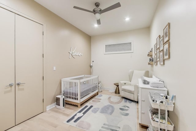 922 N Hermitage Ave Unit 1, Chicago, IL 60622 - bedroom with a crib, wood finished floors, a ceiling fan, and recessed lighting