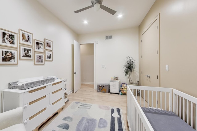 922 N Hermitage Ave Unit 1, Chicago, IL 60622 - bedroom with light wood-style flooring, recessed lighting, ceiling fan, and a crib