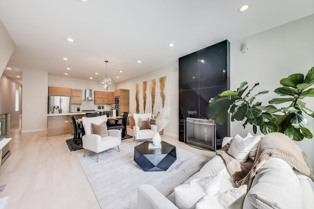 922 N Hermitage Ave Unit 1, Chicago, IL 60622 - living room with recessed lighting, a fireplace, and light wood finished floors