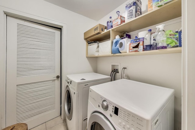 922 N Hermitage Ave Unit 1, Chicago, IL 60622 - washroom with washing machine and dryer and light tile patterned floors