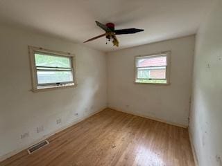 574 Isa Dr, Wheeling, IL 60090 - spare room with wood finished floors and ceiling fan