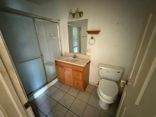 574 Isa Dr, Wheeling, IL 60090 - bathroom featuring vanity, tile patterned floors, and a stall shower