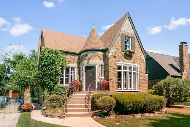 400 Selborne Rd, Riverside, IL 60546 - english style home with brick siding, roof with shingles, and a chimney