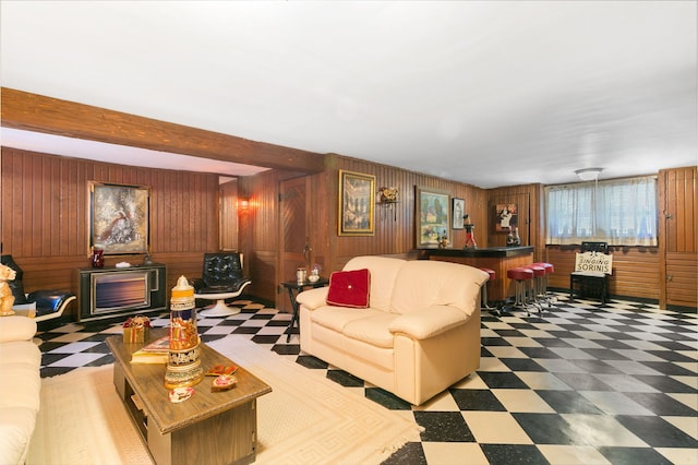 400 Selborne Rd, Riverside, IL 60546 - living area featuring wooden walls, tile patterned floors, a wood stove, and beam ceiling