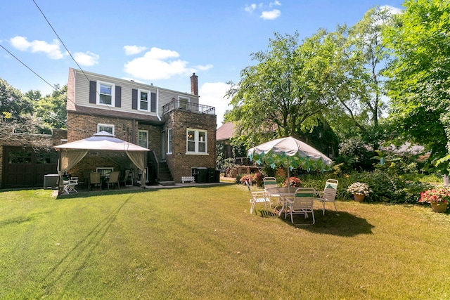 400 Selborne Rd, Riverside, IL 60546 - back of house with a gazebo, a balcony, a chimney, and a yard