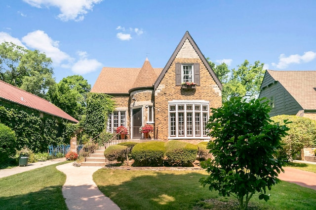 400 Selborne Rd, Riverside, IL 60546 - tudor-style house featuring brick siding and a front lawn